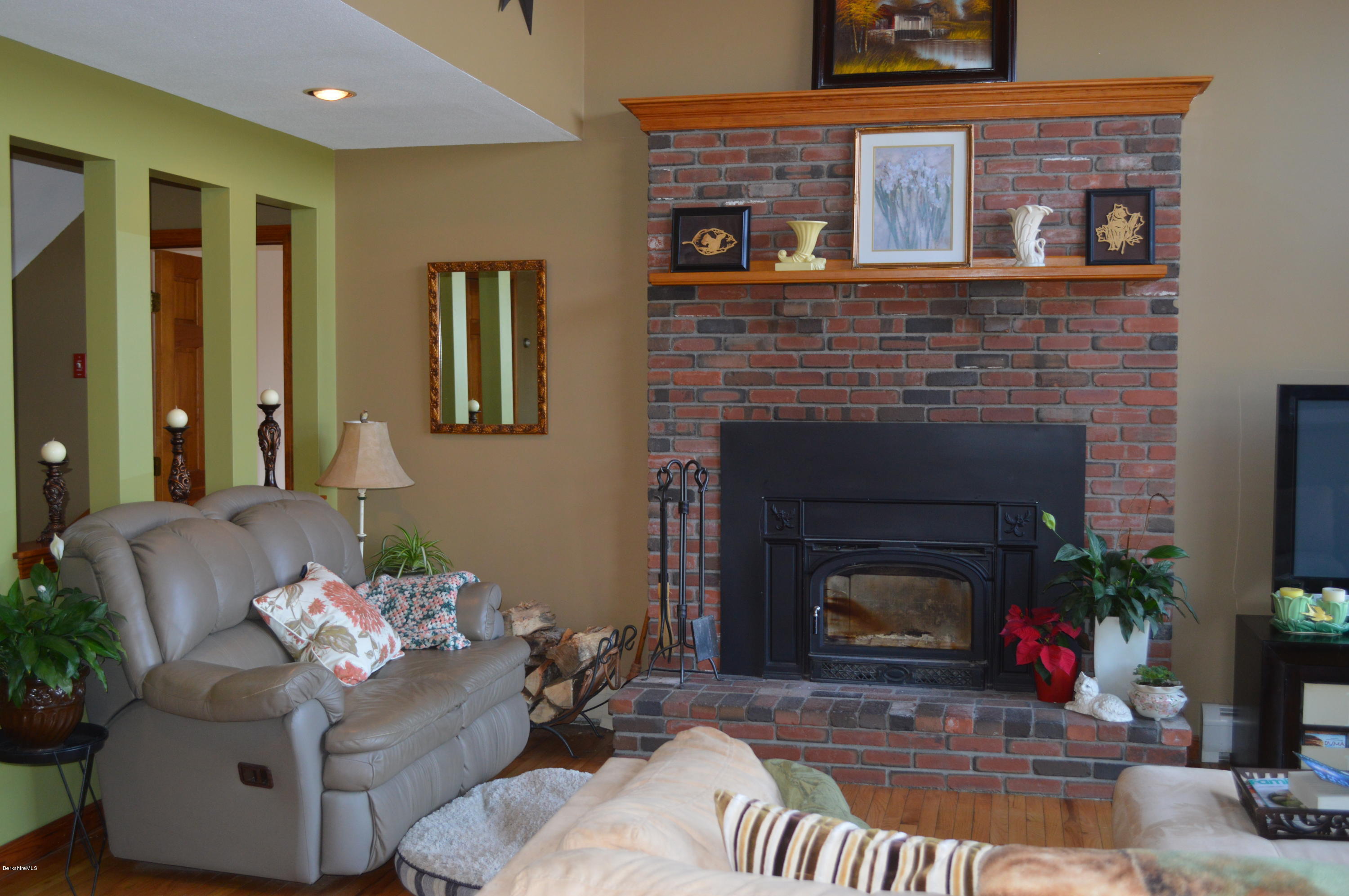 759 George Carter Road Becket, MA 01223 - Photo 4 of 56 a living room with furniture and a fireplace