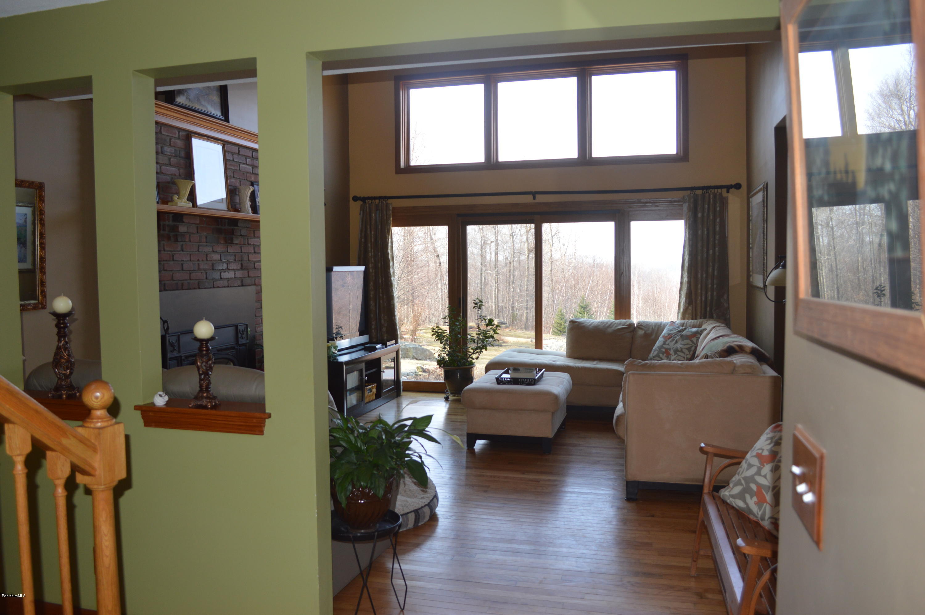 759 George Carter Road Becket, MA 01223 - Photo 5 of 56 a living room with furniture and floor to ceiling windows