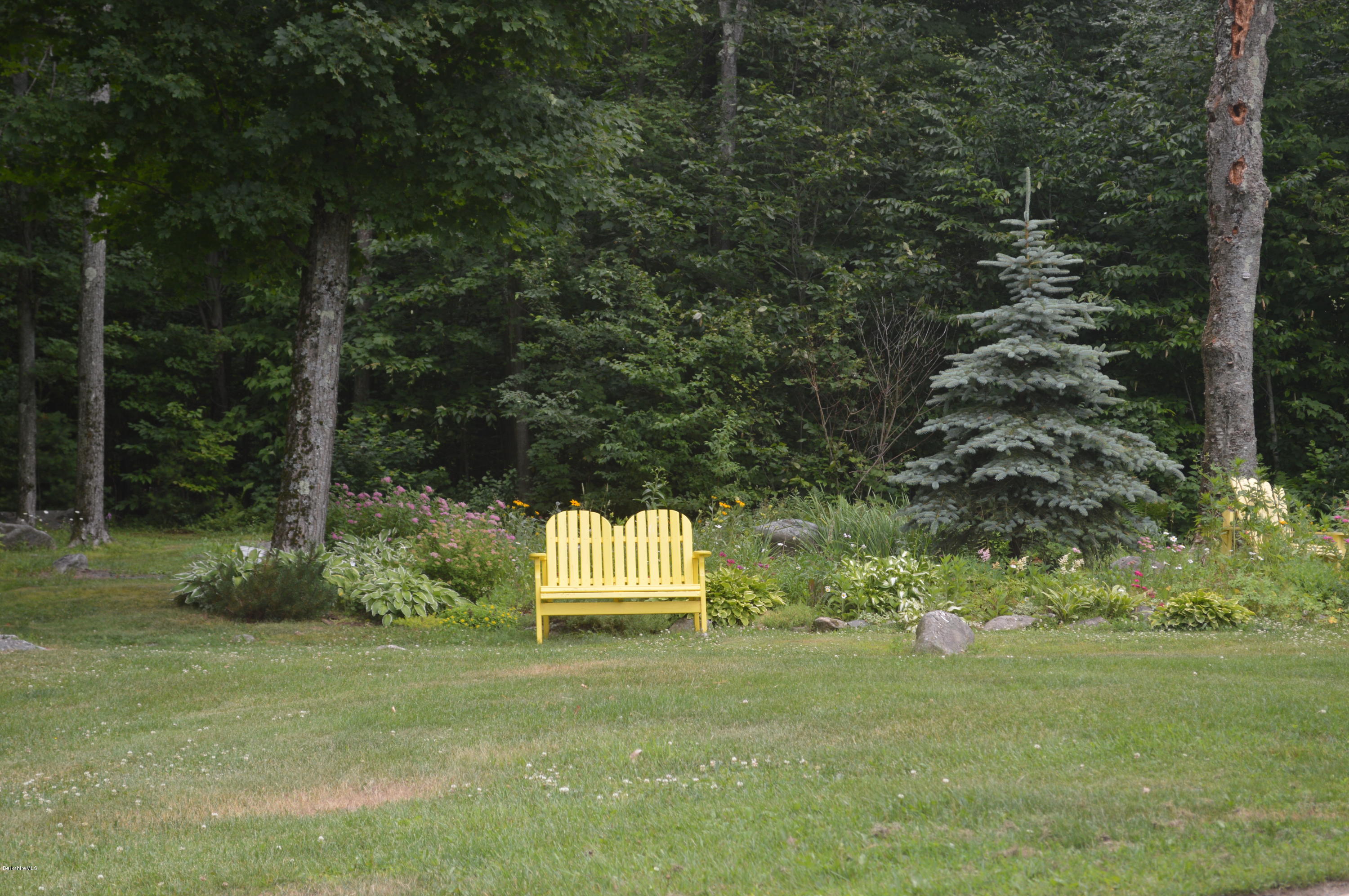 759 George Carter Road Becket, MA 01223 - Photo 51 of 56 a green field with trees in the background