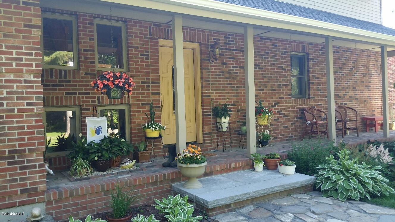 759 George Carter Road Becket, MA 01223 - Photo 56 of 56 a front view of a house with plants