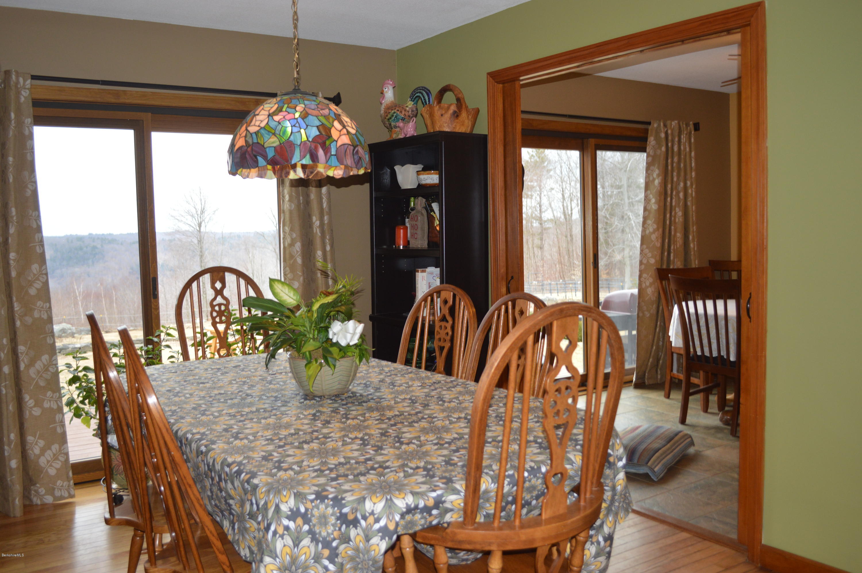 759 George Carter Road Becket, MA 01223 - Photo 7 of 56 a view of a dining room with furniture window and outside view