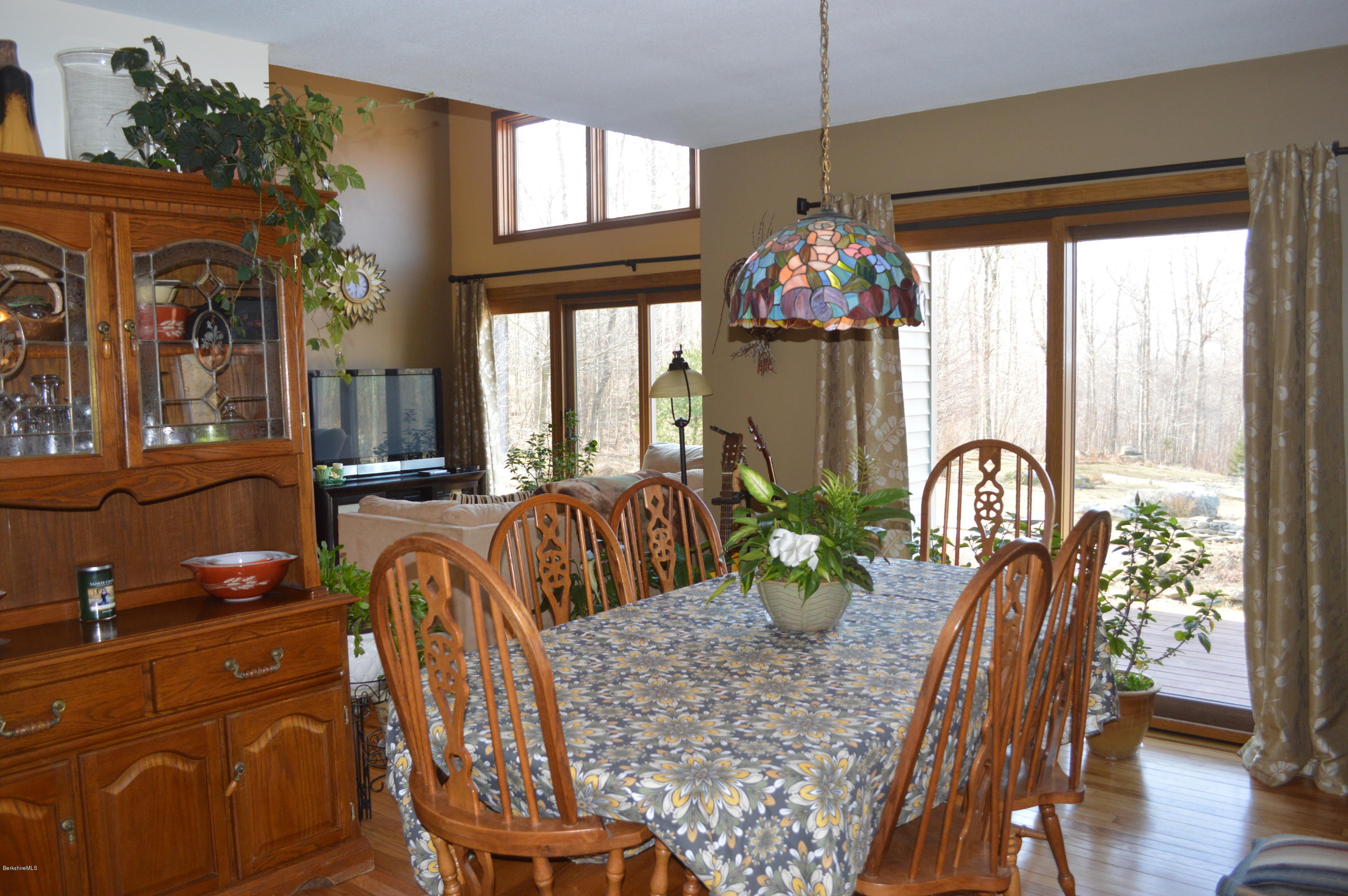 759 George Carter Road Becket, MA 01223 - Photo 8 of 56 a view of a dining room with furniture window and wooden floor