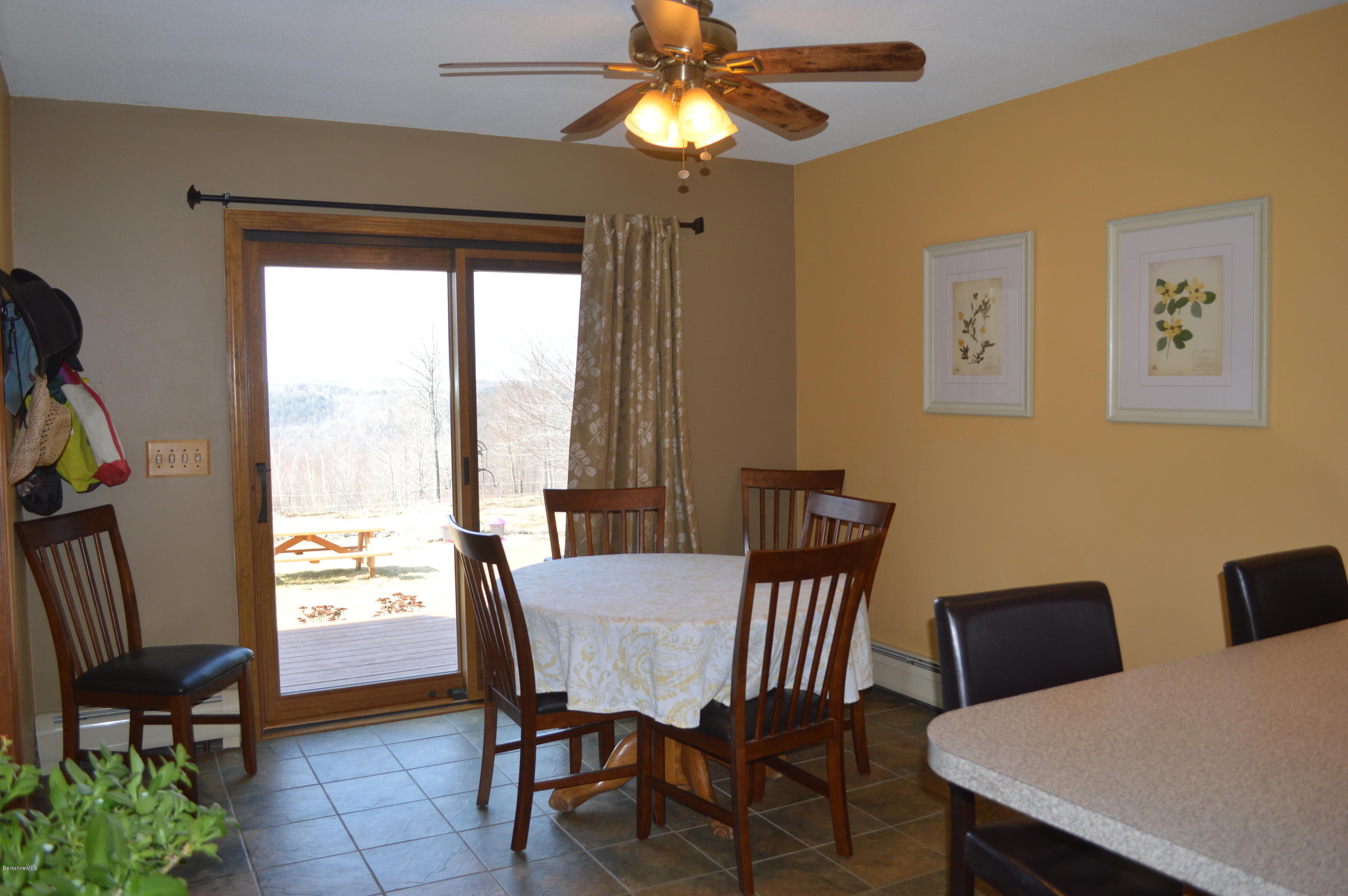 759 George Carter Road Becket, MA 01223 - Photo 10 of 56 a view of a dining room with furniture window and outside view