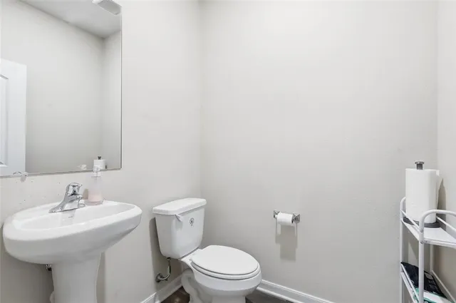 a bathroom with a granite countertop sink and a bathtub
