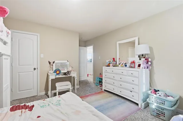 a bedroom with a bed and a table