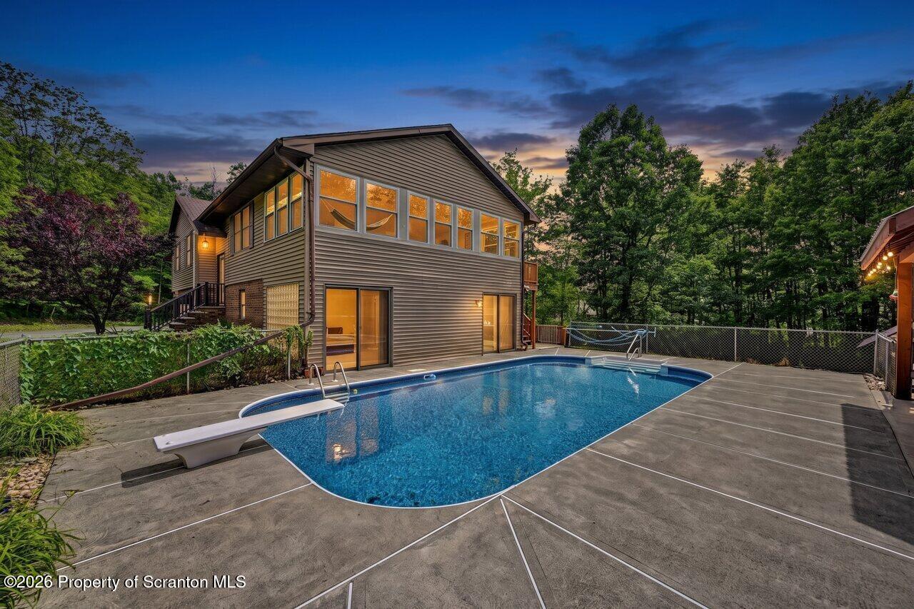 211 Buckingham Street Moscow, PA 18444 - Photo 6 of 83 a view of a house with a swimming pool