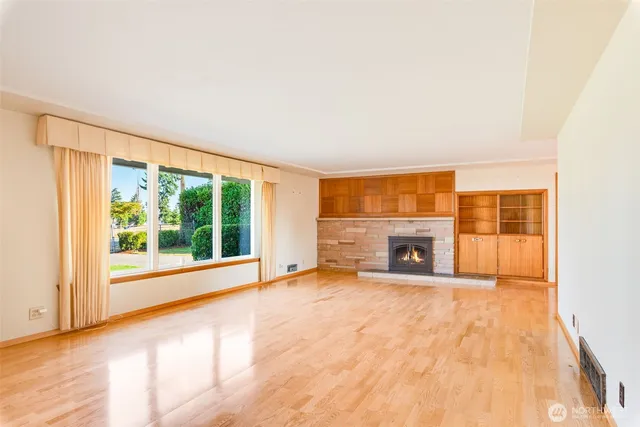a living room with furniture tv and a fireplace