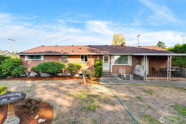 a view of a house with a yard potted plants