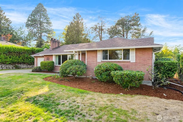 an entryway with chandelier in front of door