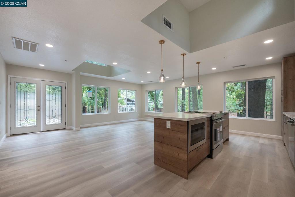 1244 Stone Valley Road Alamo, CA 94507 - Photo 12 of 20 a kitchen with stainless steel appliances granite countertop a stove and a wooden floors