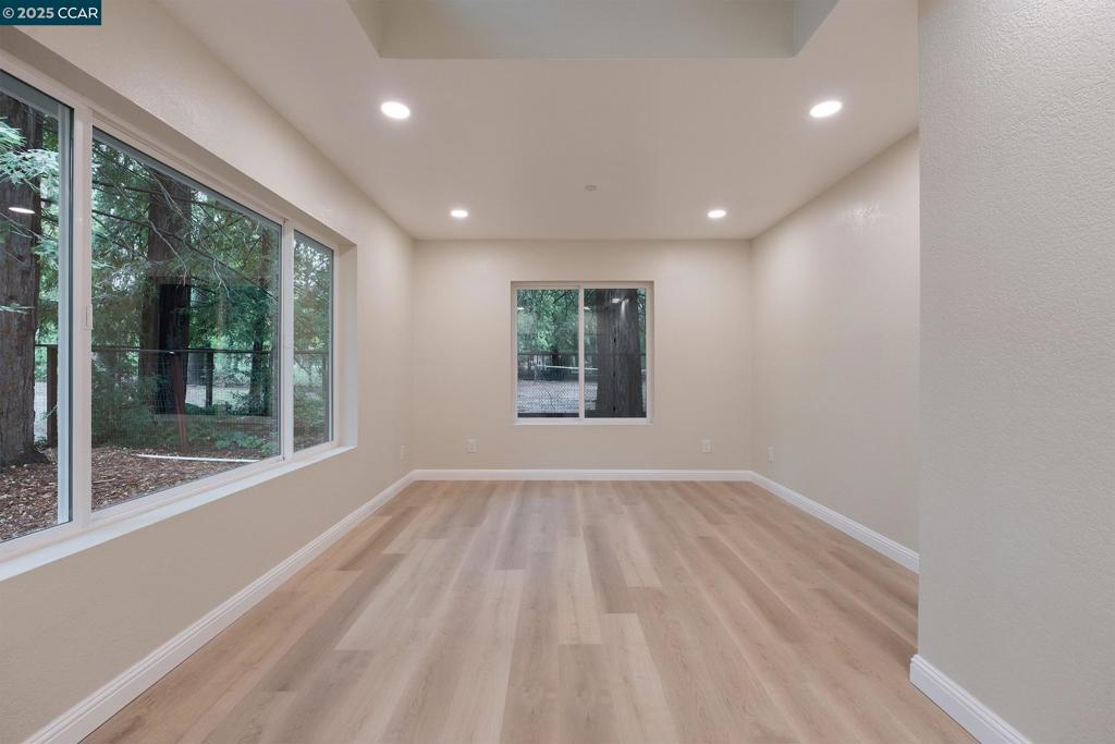 1244 Stone Valley Road Alamo, CA 94507 - Photo 17 of 20 a view of an empty room with wooden floor and a window