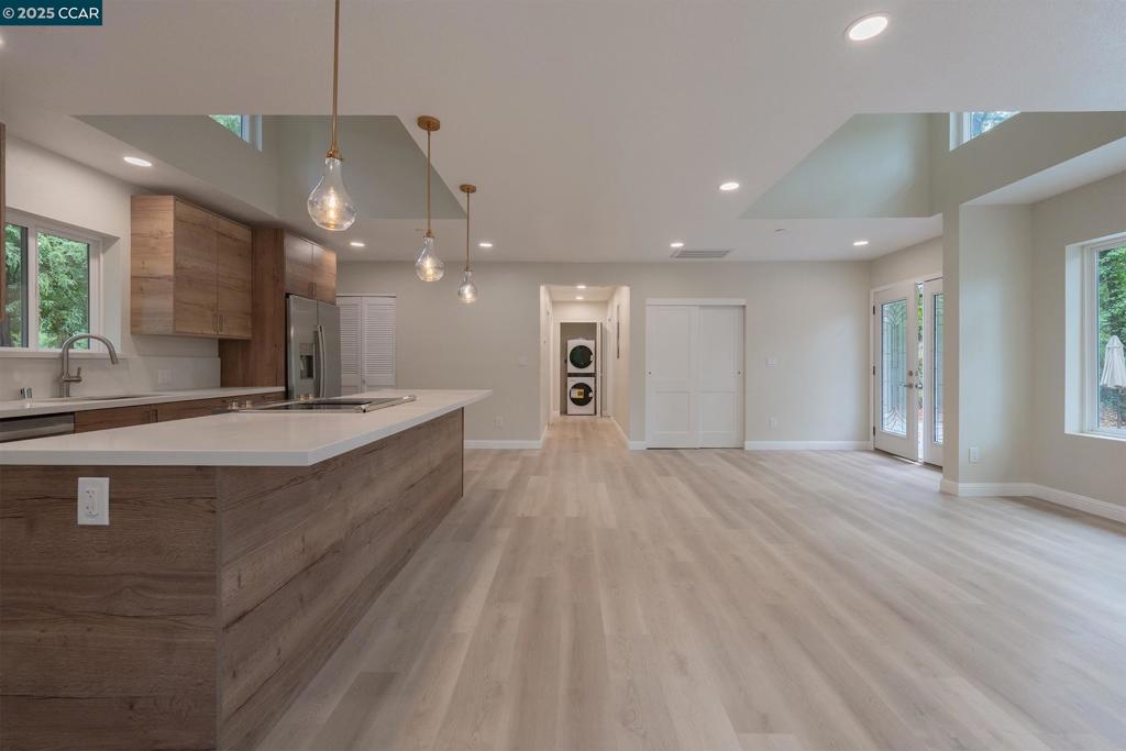 1244 Stone Valley Road Alamo, CA 94507 - Photo 9 of 20 a large kitchen with stainless steel appliances a large counter top a refrigerator and a sink