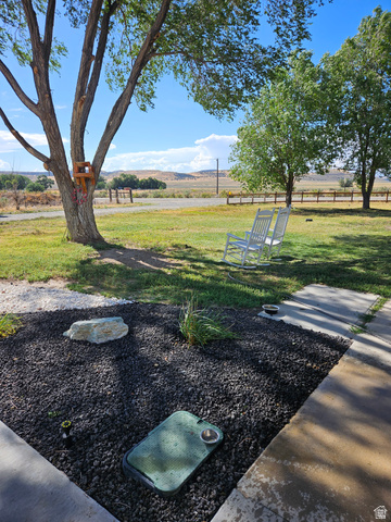 830 North Stone Road Snowville, UT 84336 - Photo 31 of 69 View of grassy yard with a rural view