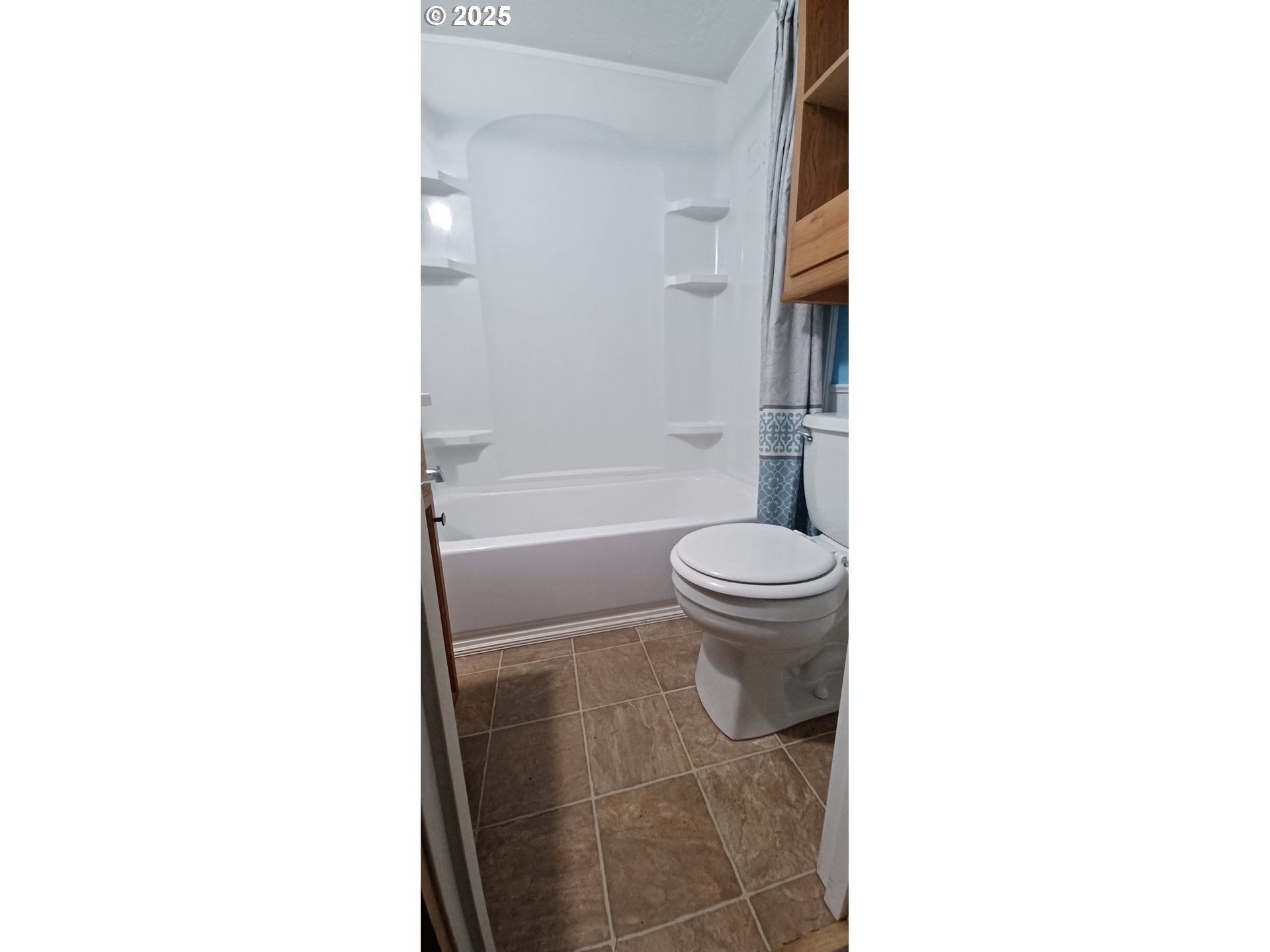 1740 Southeast River Forest Road Milwaukie, OR 97267 - Photo 8 of 9 a bathroom with a toilet and a bathtub