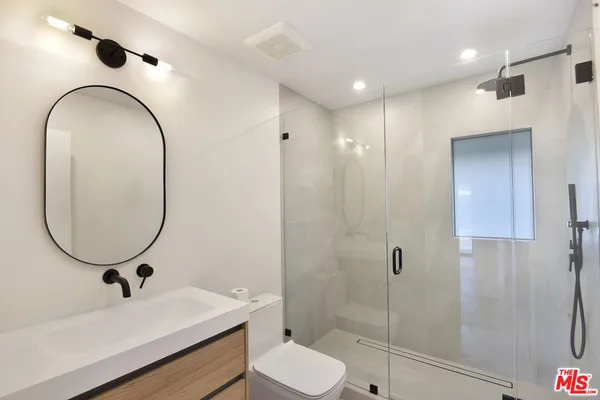 a view of an empty room with glass door