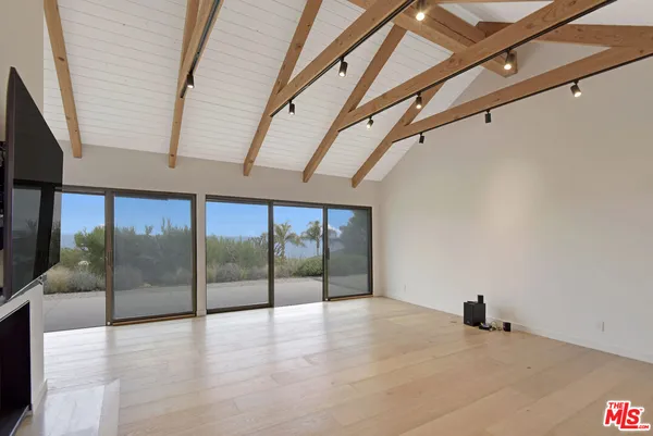 a view of a livingroom with wooden floor