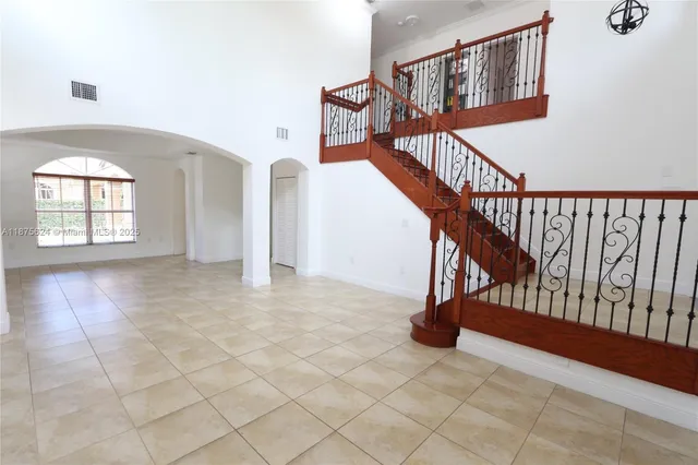 a view of empty room with windows