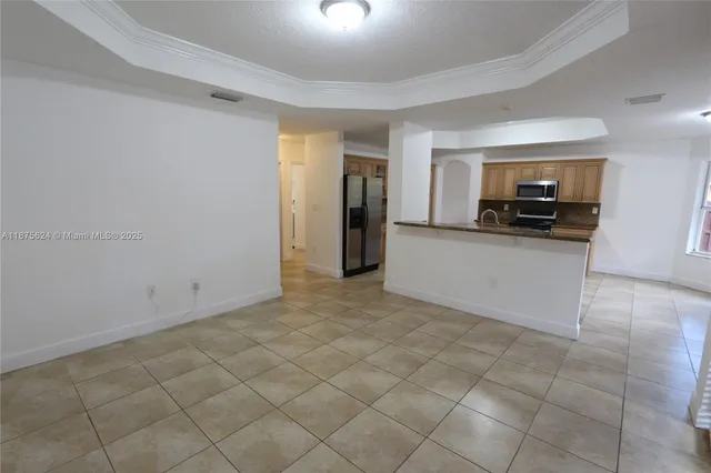 a view of a kitchen with a sink cabinets and a window