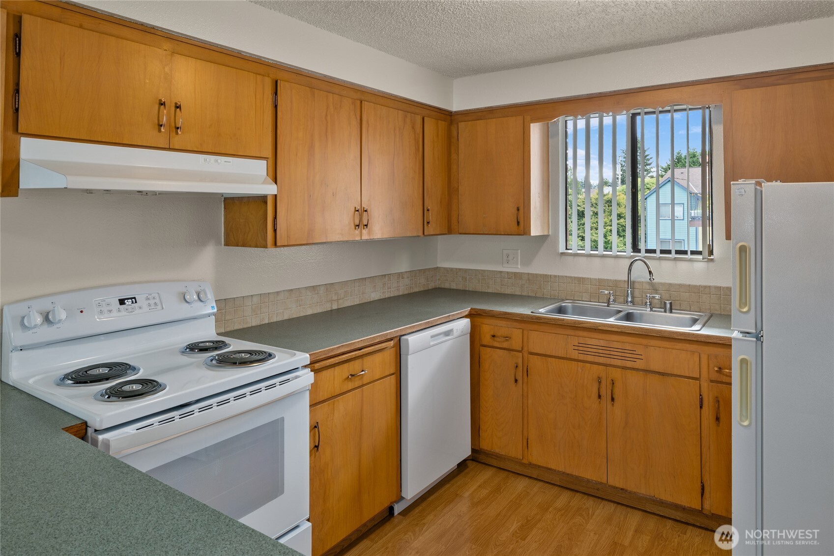 2517 Howard Avenue Everett, WA 98203 - Photo 14 of 32 a kitchen with appliances cabinets and a sink