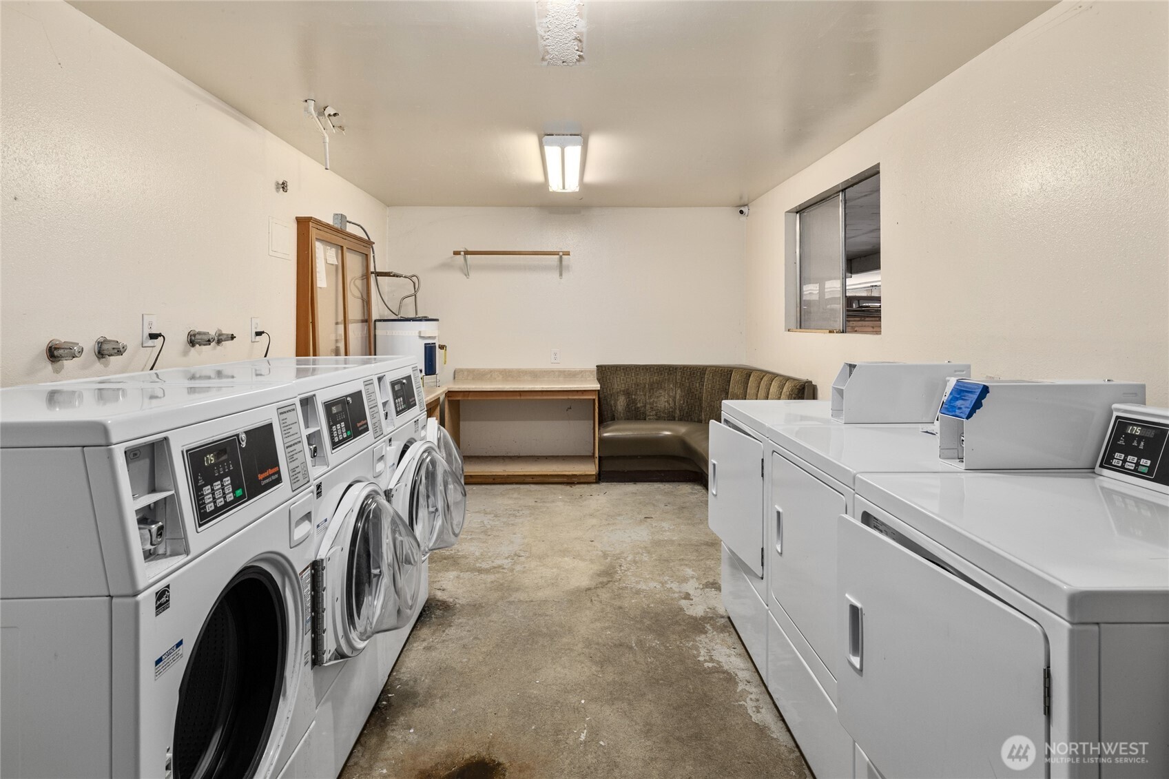 2517 Howard Avenue Everett, WA 98203 - Photo 29 of 32 a view of washer and dryer with kitchen in the background
