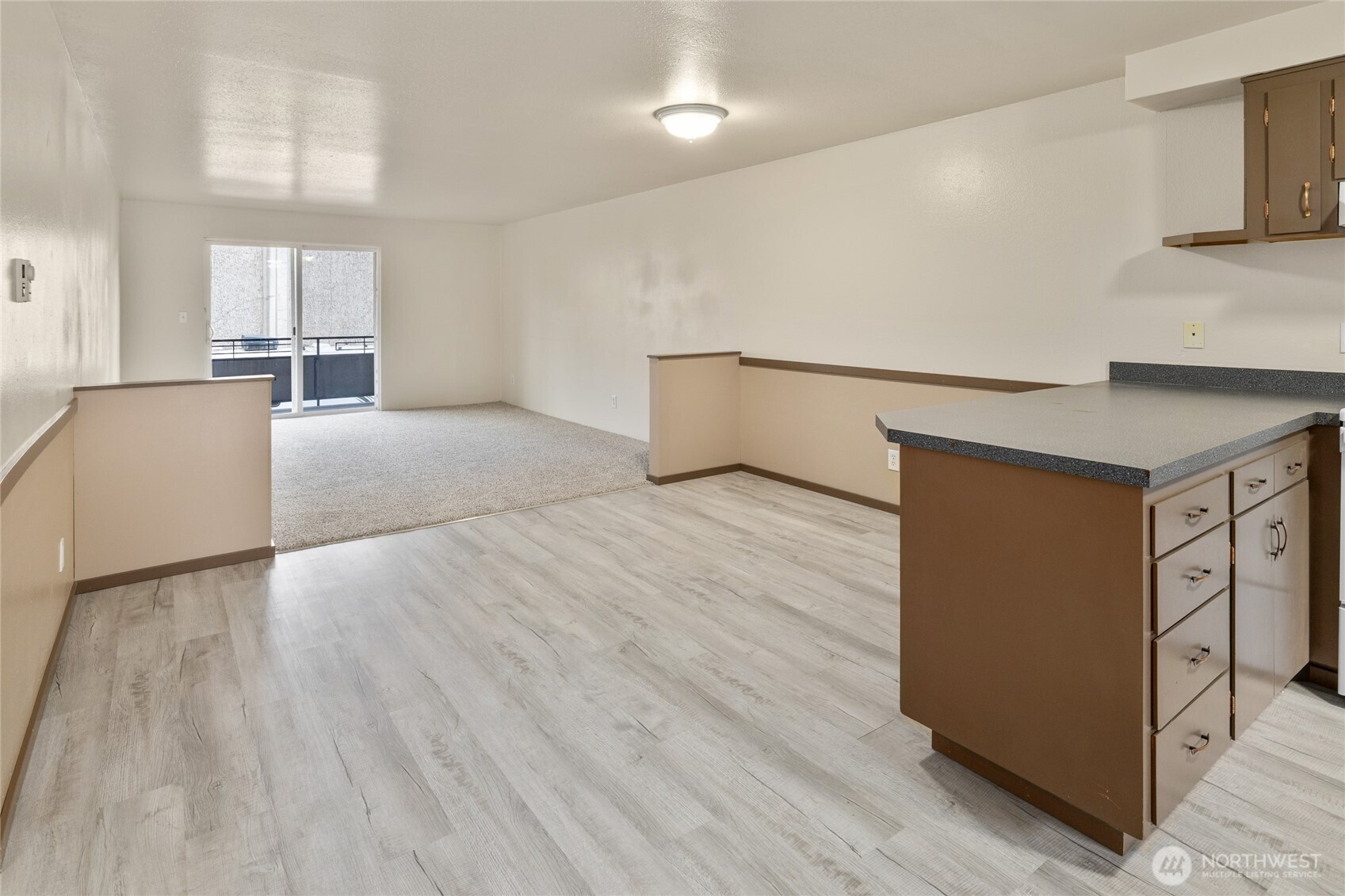 2517 Howard Avenue Everett, WA 98203 - Photo 7 of 32 a view of a kitchen with wooden floor and electronic appliances
