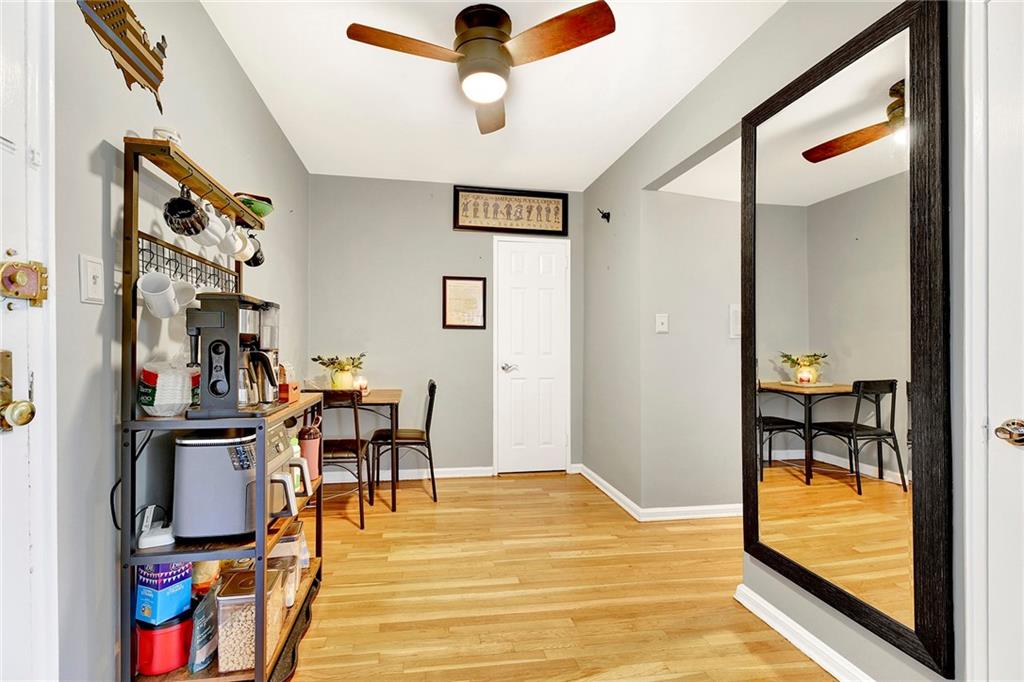7259 Shore Road, Unit 2G Brooklyn, NY 11209 - Photo 3 of 16 a view of a livingroom with furniture and a ceiling fan