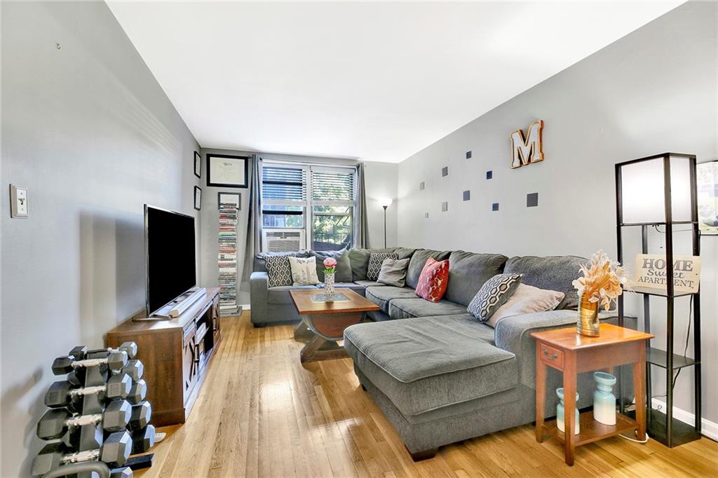 7259 Shore Road, Unit 2G Brooklyn, NY 11209 - Photo 5 of 16 a living room with furniture and wooden floor