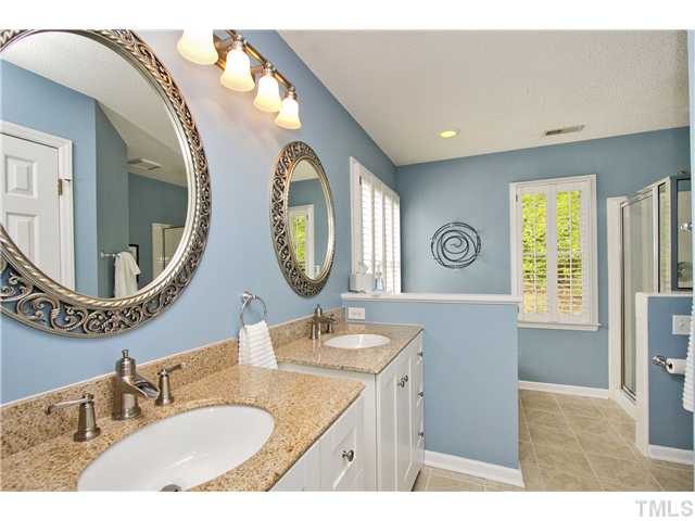315 Catlin Road Cary, NC 27519 - Photo 13 of 25 Master bath has dual vanity, garden tub, tile floor and separate shower.