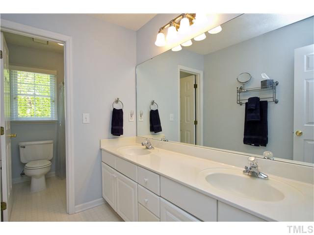 315 Catlin Road Cary, NC 27519 - Photo 17 of 25 Hall bath has dual vanity and separate room for the shower and commode