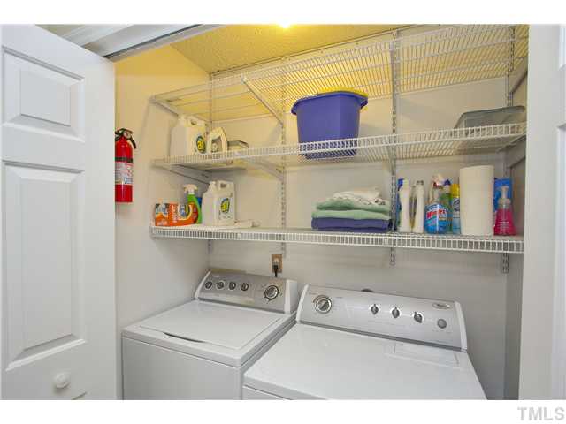 315 Catlin Road Cary, NC 27519 - Photo 18 of 25 Utility closet with plenty of shelves for storage. Washer and dryer convey.