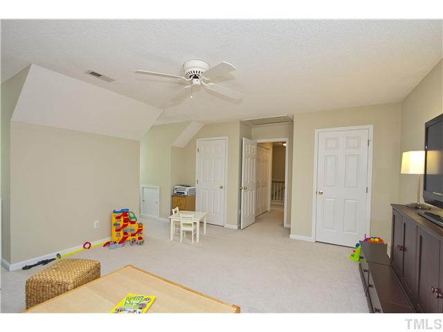 315 Catlin Road Cary, NC 27519 - Photo 20 of 25 The bonus room has two closets and storage spaces in the dormers