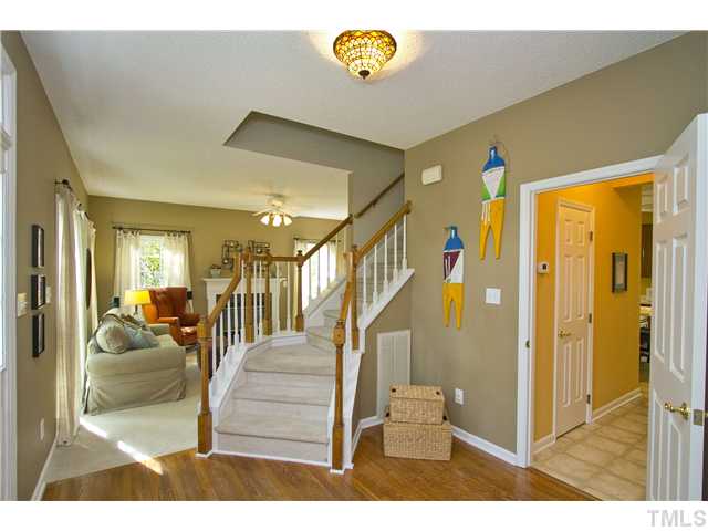Notice the hardwoods and the stairs are off to the side (not directly in front of the door).