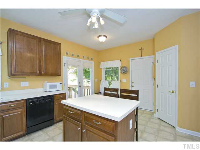 Another view of the kitchen with the door out to the deck