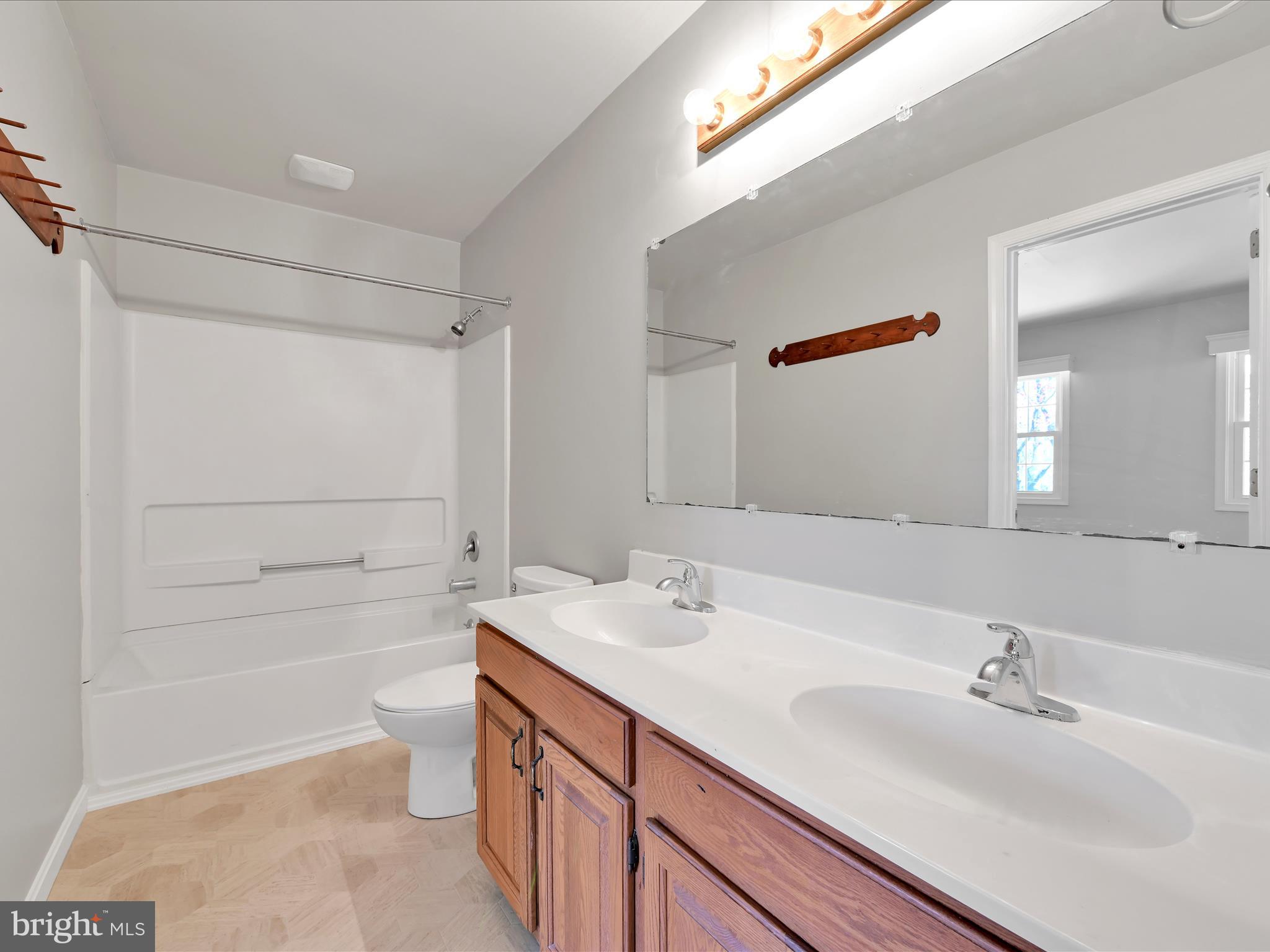 62 Brookfield Road Lititz, PA 17543 - Photo 18 of 27 a bathroom with a bathtub shower sink vanity and toilet