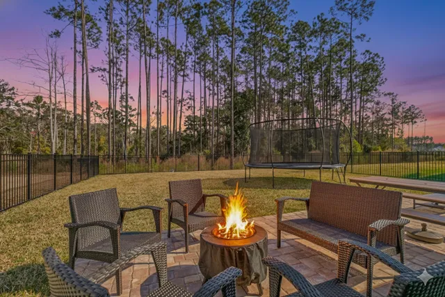 a view of a chairs and table in the patio