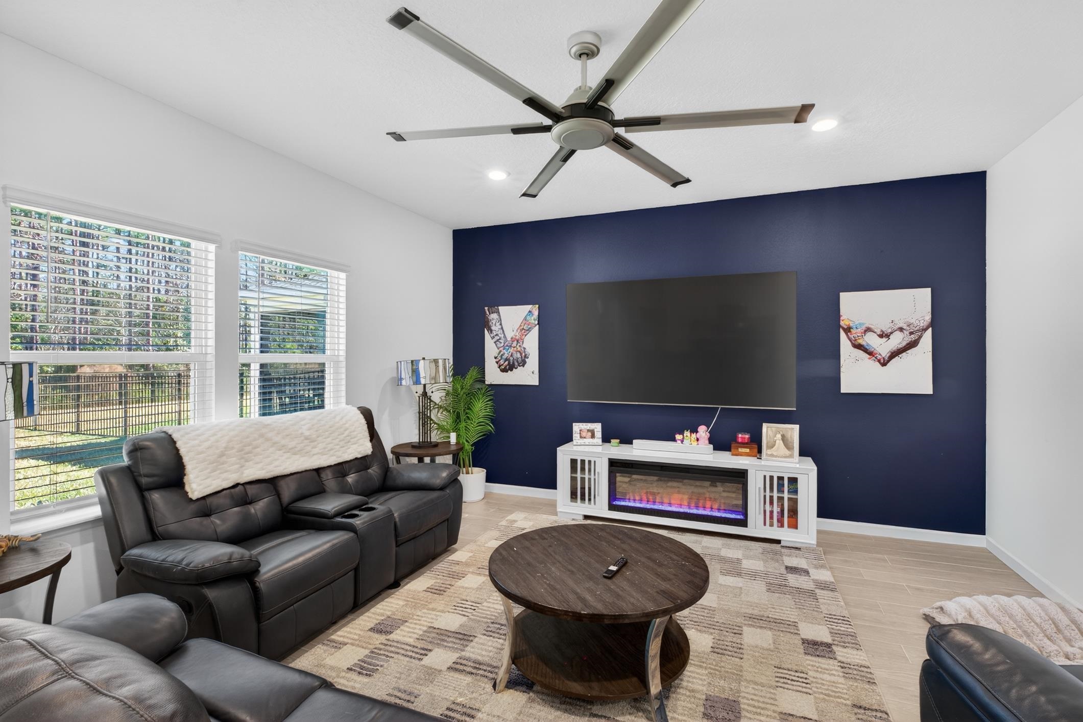 177 White Rabbit Run St. Augustine, FL 32092 - Photo 13 of 51 Living area featuring an accent wall, ceiling fan, recessed lighting, and light wood-style floors