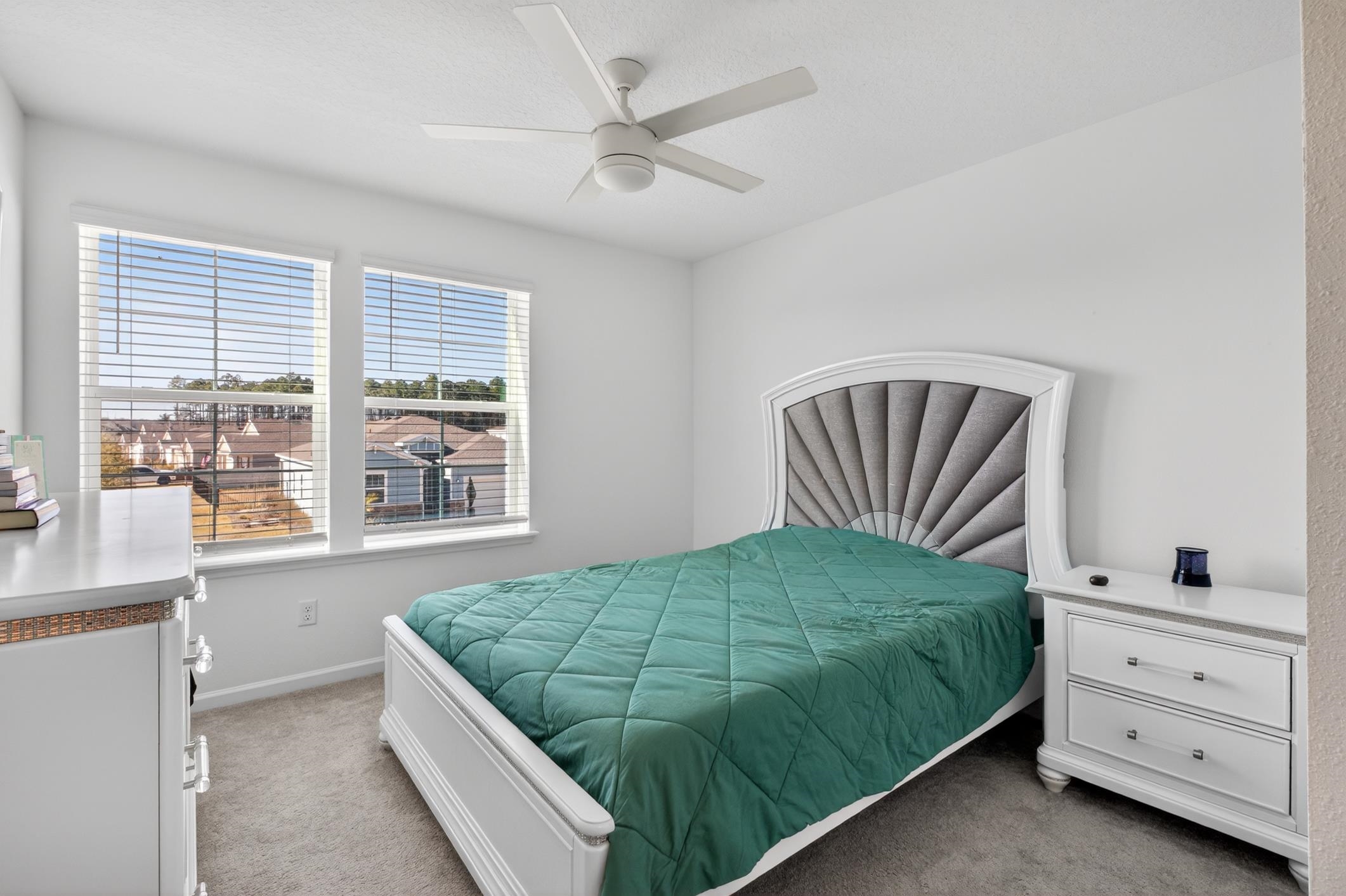 177 White Rabbit Run St. Augustine, FL 32092 - Photo 31 of 51 a bedroom with a bed and a window