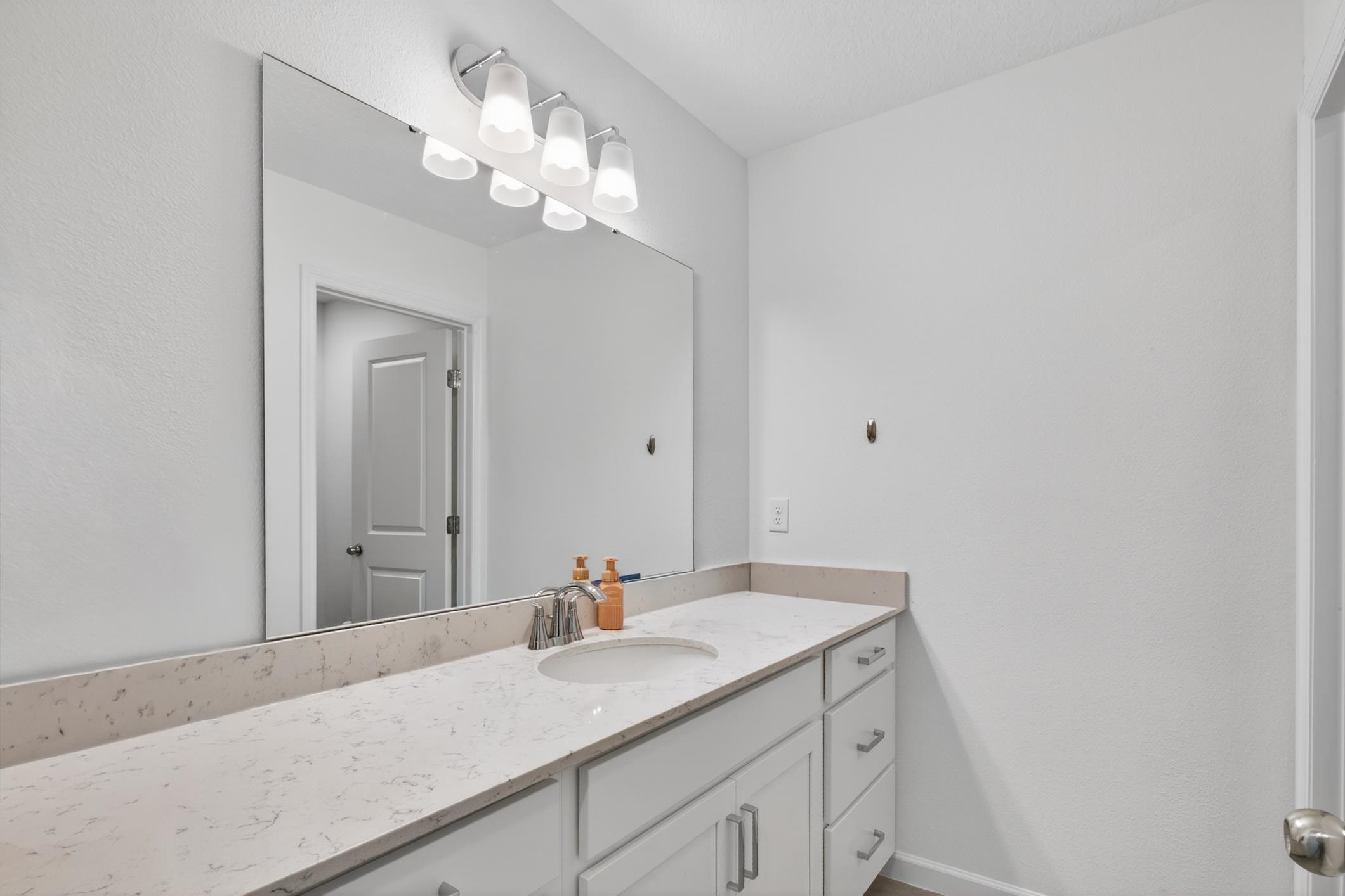 177 White Rabbit Run St. Augustine, FL 32092 - Photo 36 of 51 Bathroom featuring vanity and baseboards