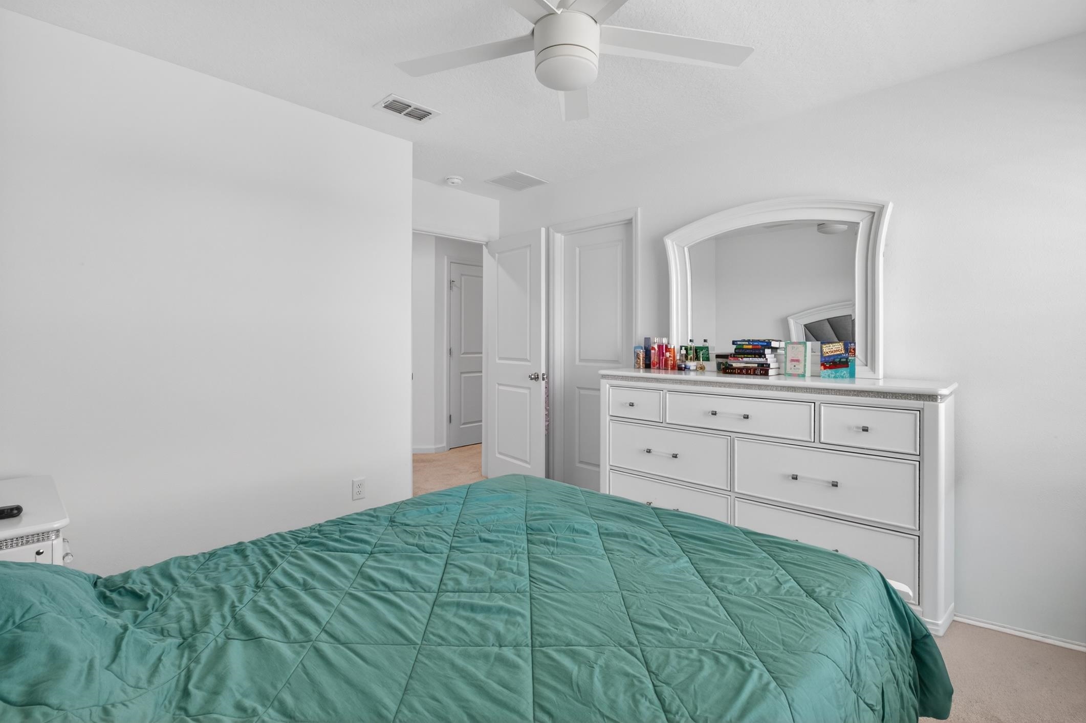 177 White Rabbit Run St. Augustine, FL 32092 - Photo 37 of 53 Bedroom with a ceiling fan and light colored carpet