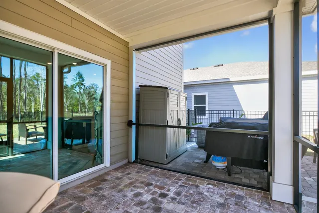a view of backyard with a table and chairs