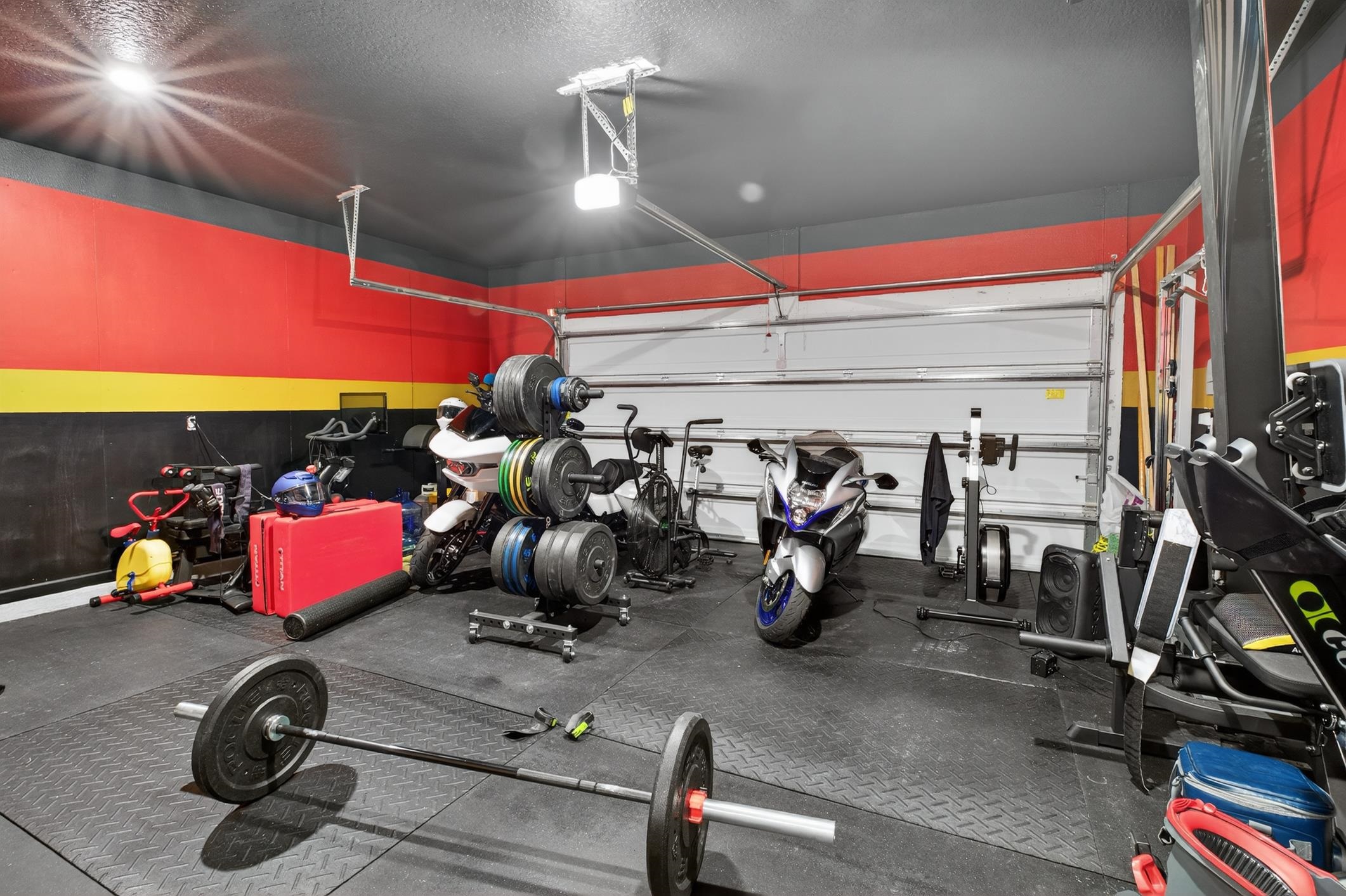 177 White Rabbit Run St. Augustine, FL 32092 - Photo 42 of 53 Workout area featuring rubber floors, a garage, and a textured ceiling