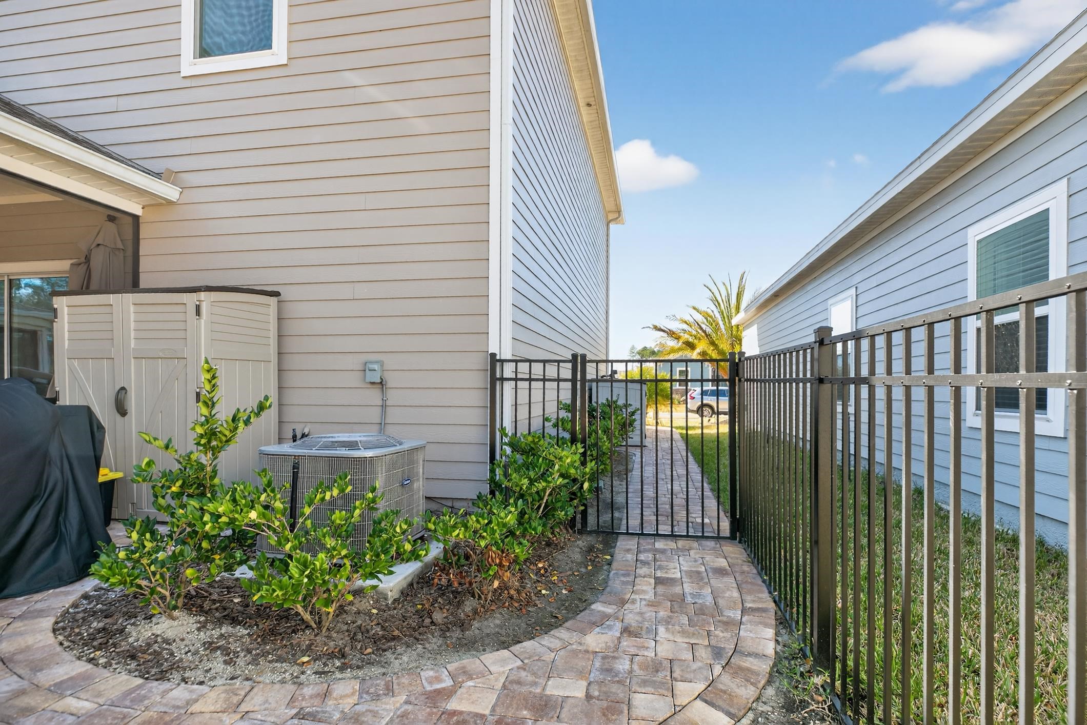 177 White Rabbit Run St. Augustine, FL 32092 - Photo 7 of 51 a view of a pathway of house with potted plants