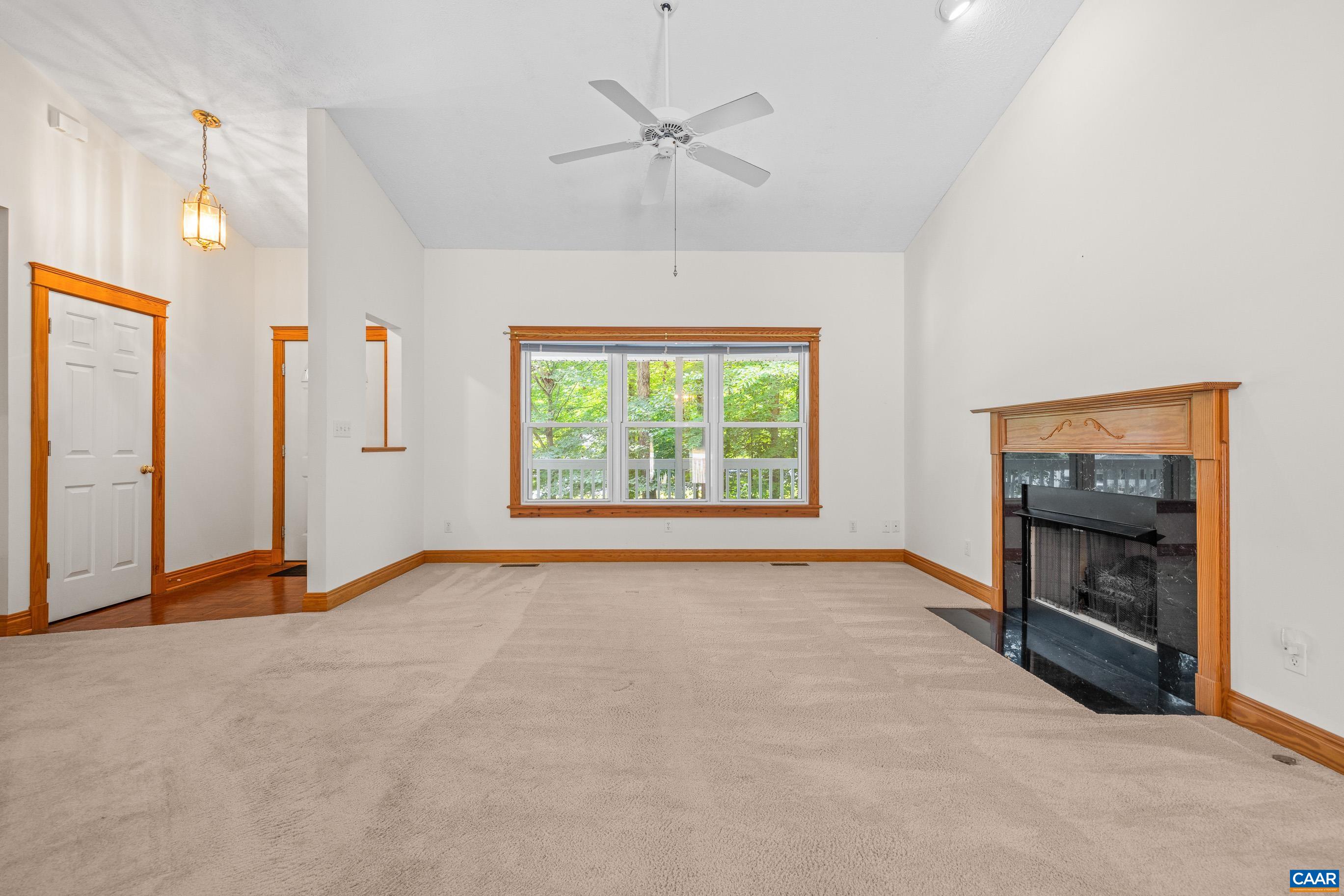 90 Riverside Drive Palmyra, VA 22963 - Photo 12 of 30 an empty room with windows and fireplace