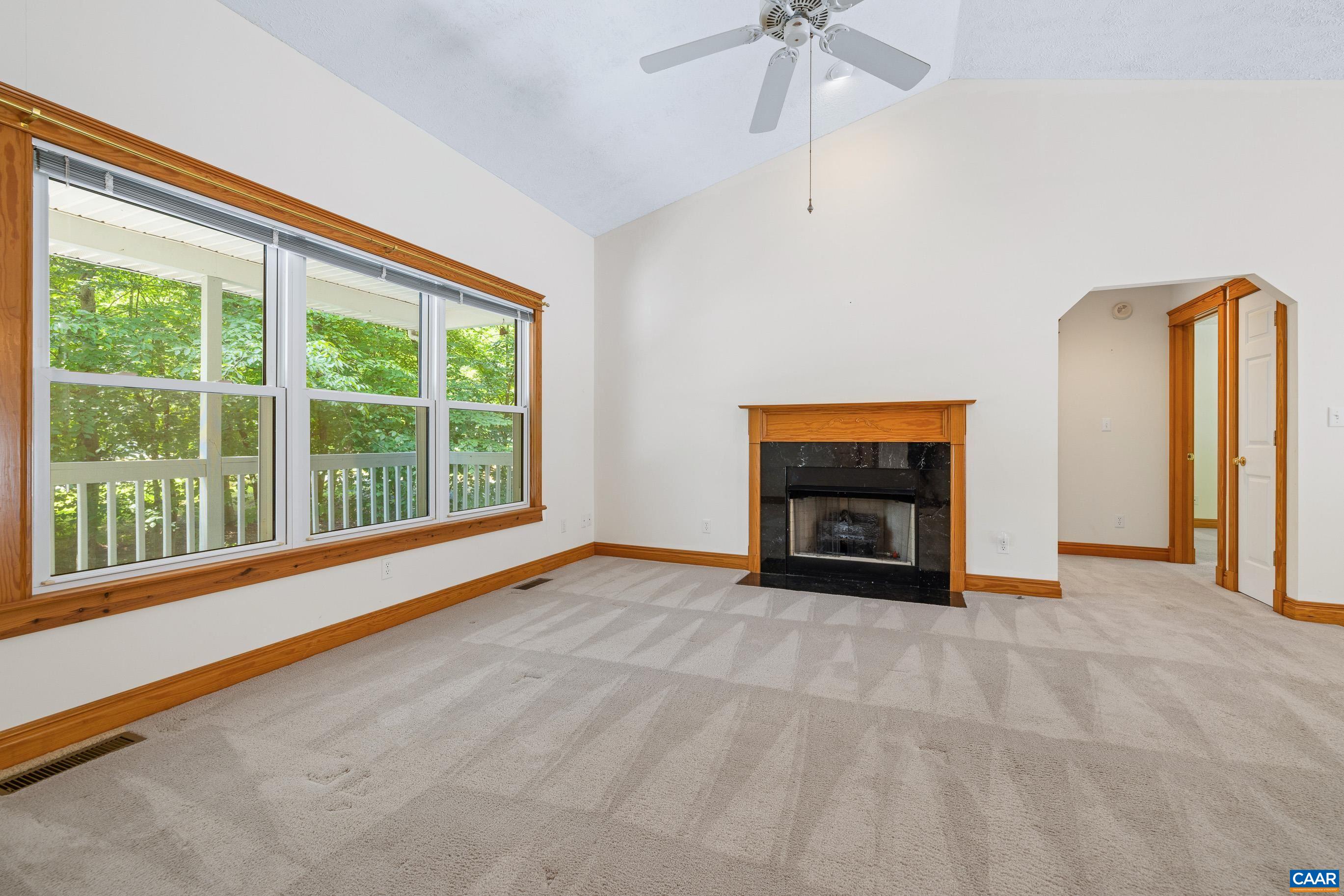 90 Riverside Drive Palmyra, VA 22963 - Photo 14 of 30 a view of an empty room with a fireplace and a window