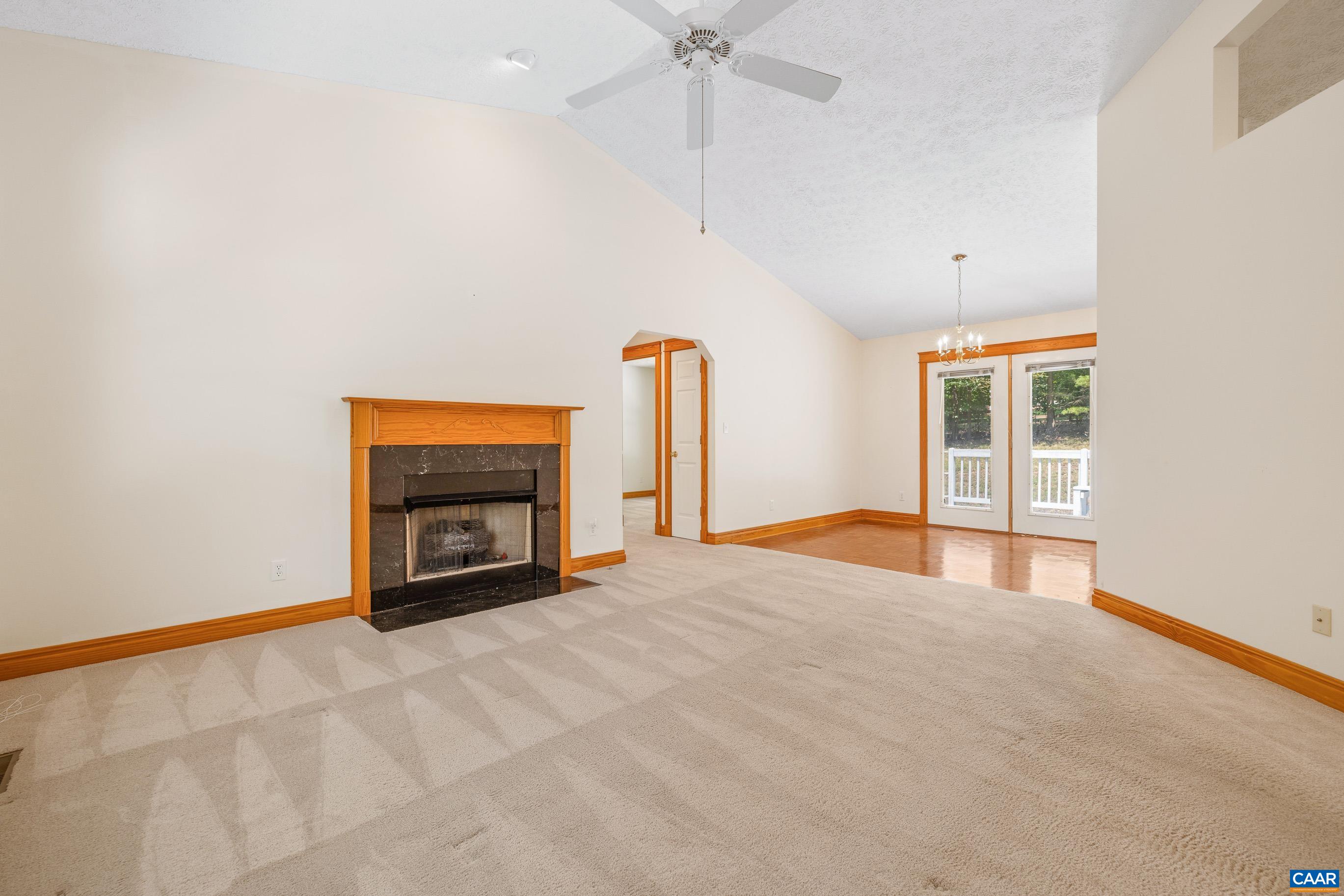 90 Riverside Drive Palmyra, VA 22963 - Photo 15 of 30 an empty room with a fireplace and fan