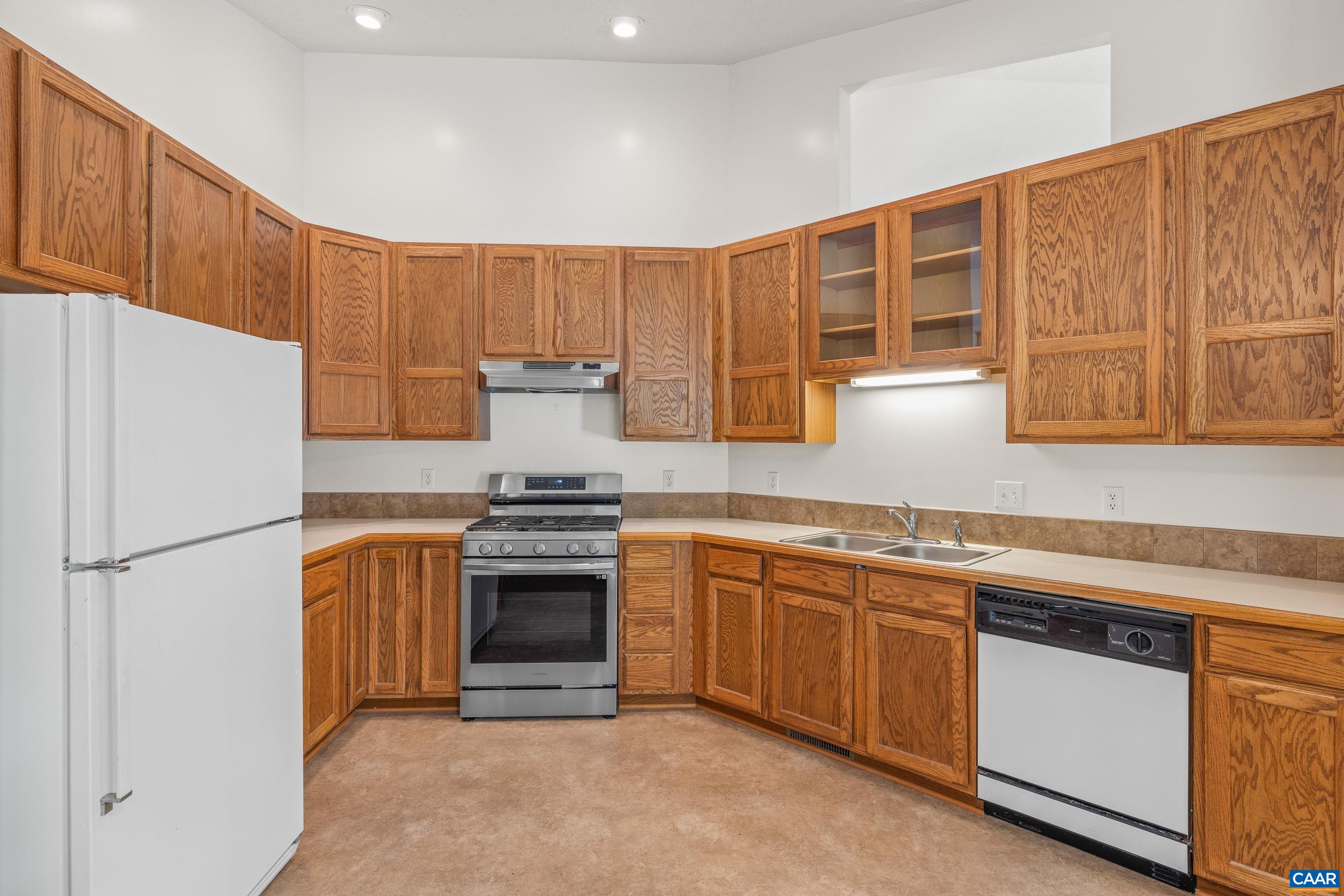 90 Riverside Drive Palmyra, VA 22963 - Photo 17 of 30 a kitchen with stainless steel appliances granite countertop a refrigerator a sink and a stove