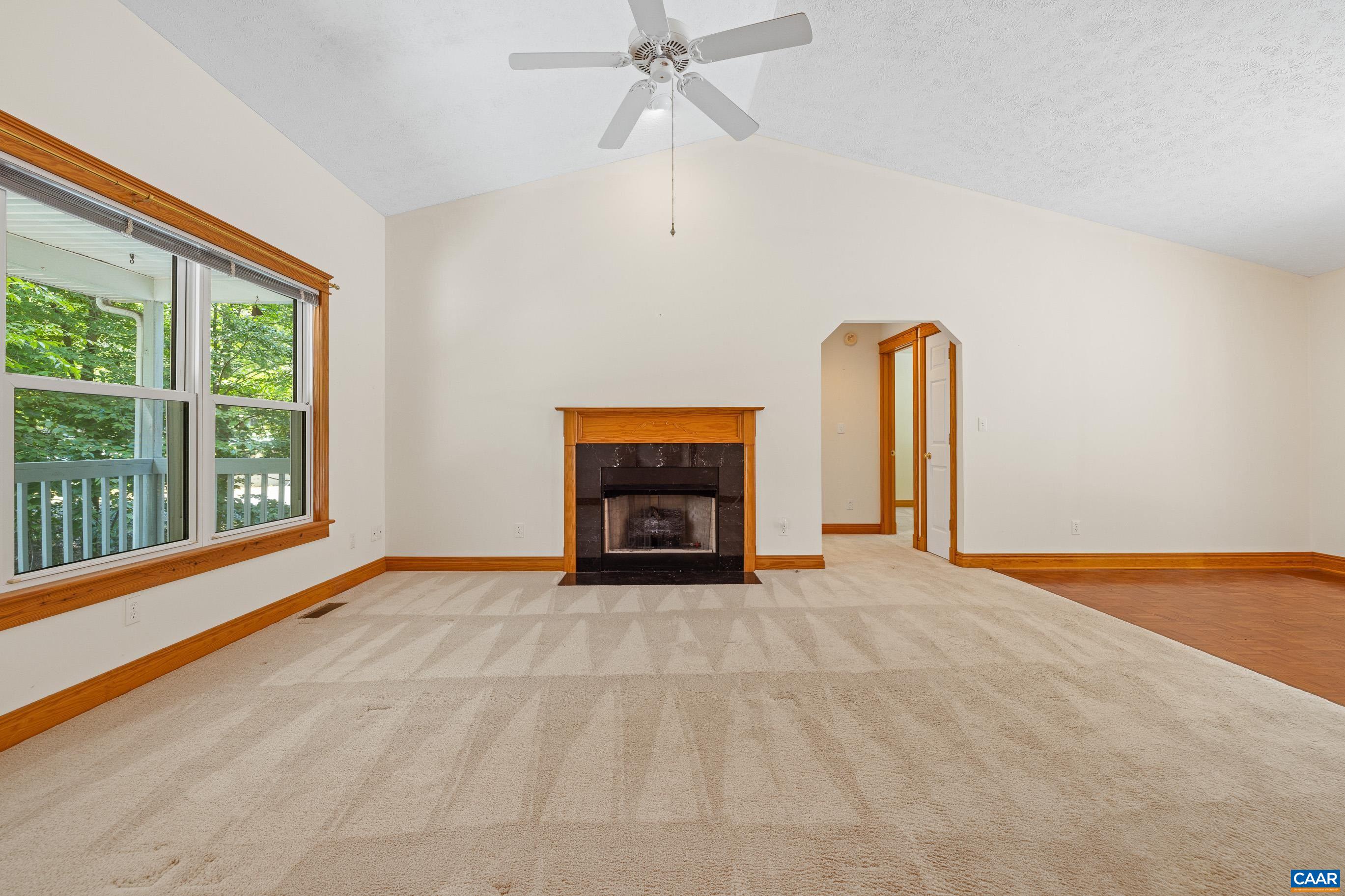90 Riverside Drive Palmyra, VA 22963 - Photo 4 of 30 a view of an empty room with a fireplace and a window