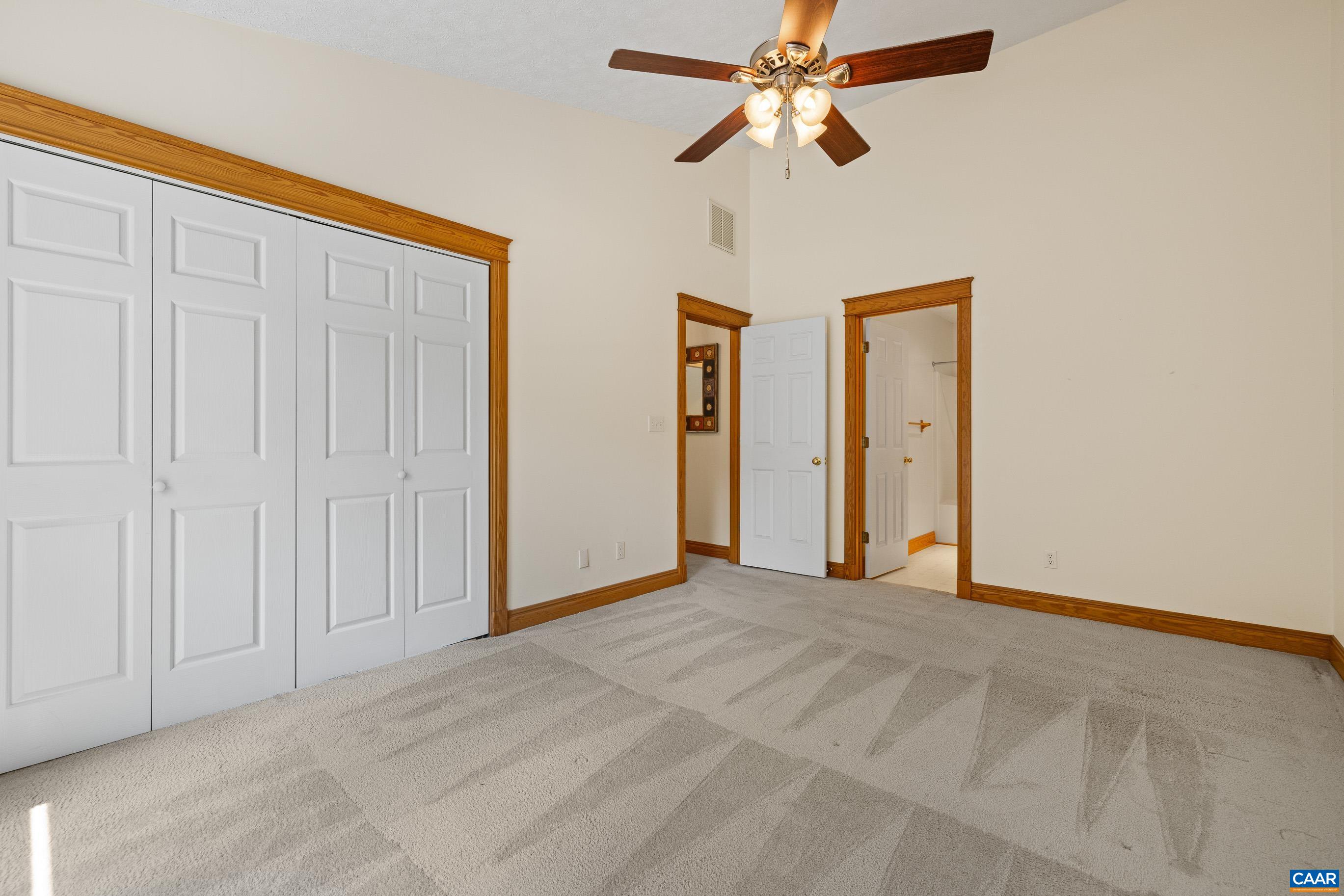 90 Riverside Drive Palmyra, VA 22963 - Photo 6 of 30 an empty room with closet and a chandelier fan