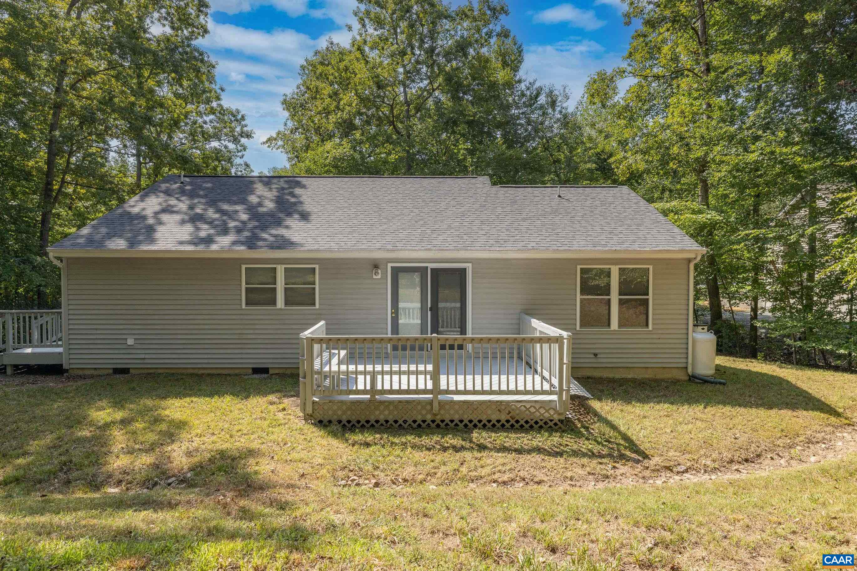 90 Riverside Drive Palmyra, VA 22963 - Photo 8 of 30 a view of a house with a yard and a large tree