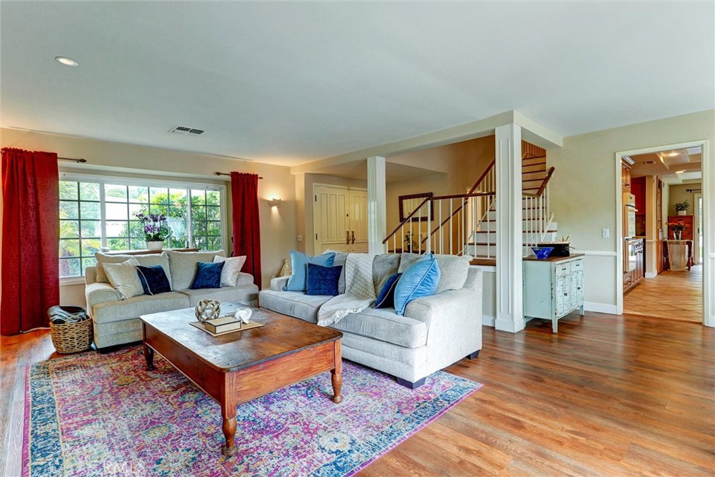 19238 Castlebay Lane Porter Ranch, CA 91326 - Photo 6 of 38 a living room with fireplace furniture and a wooden floor
